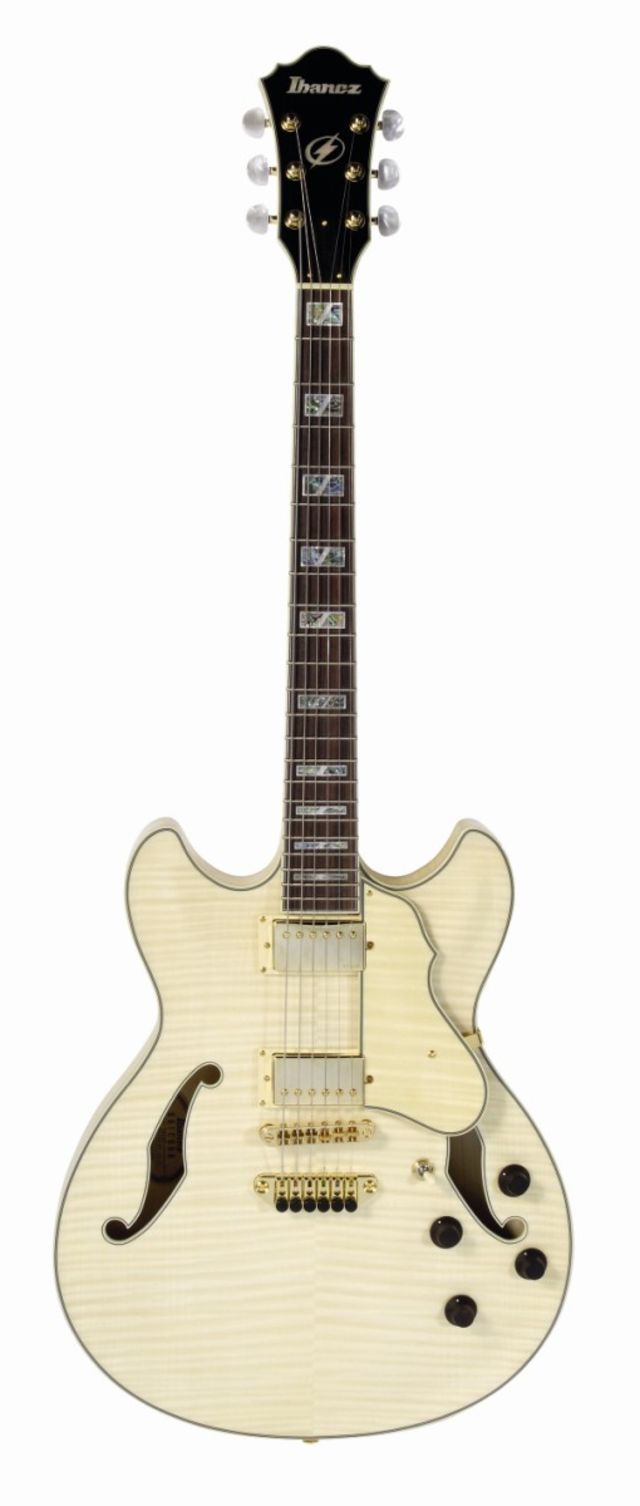 The neck comprises a five-way laminate of maple and thin strips of bubinga.